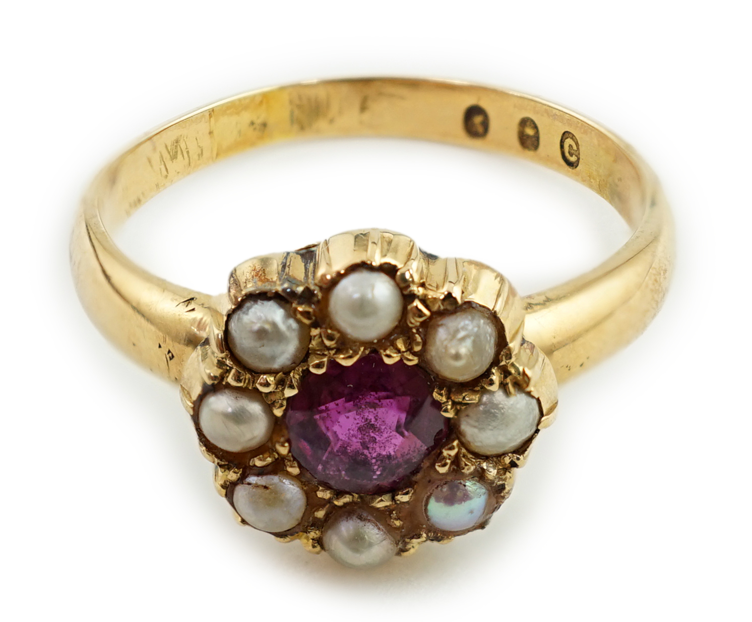 A gold, ruby and split pearl cluster ring